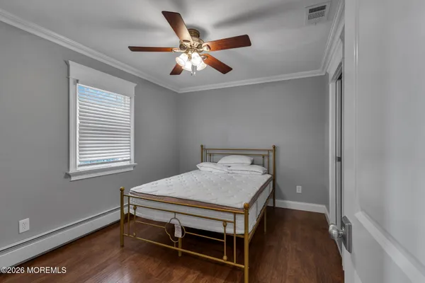 a bed room with a bed and a window