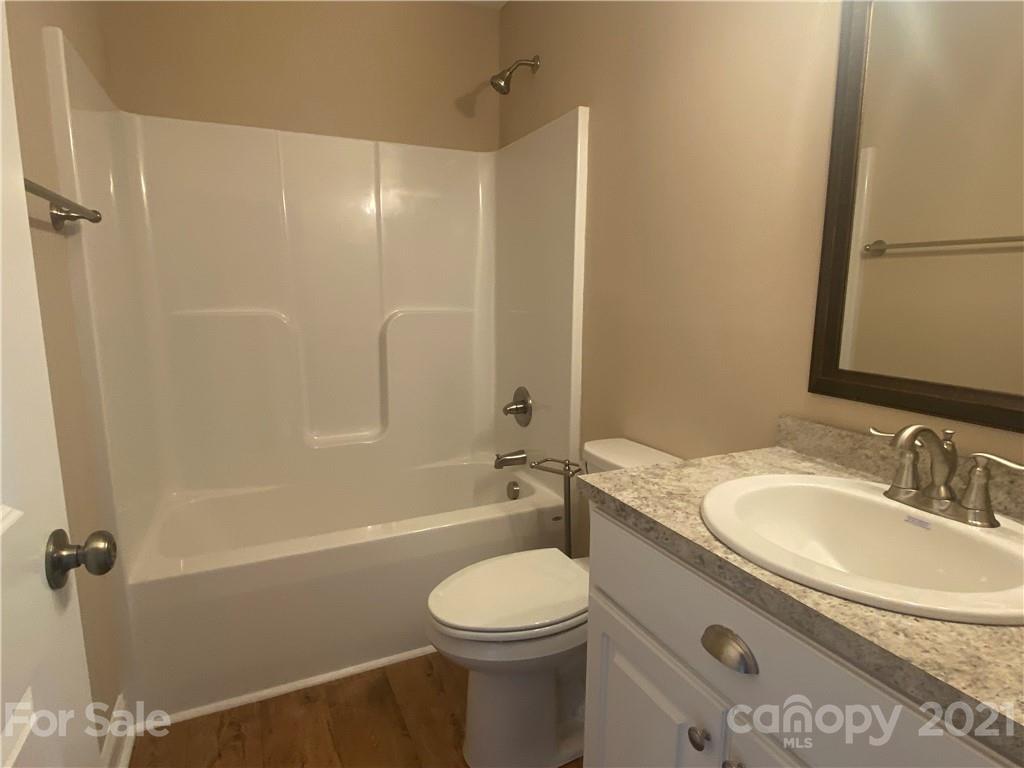 1505 Foxbrook Circle Lancaster, SC 29720 - Photo 5 of 7 a bathroom with a granite countertop sink toilet and shower