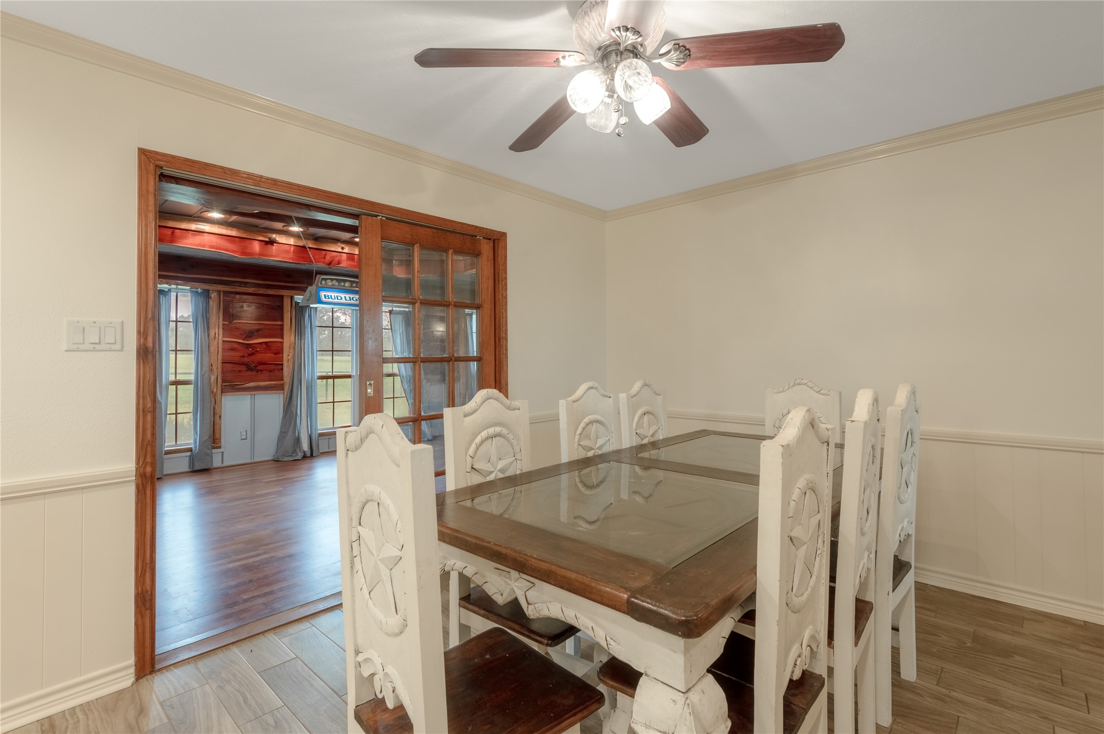 758 Wire Road Huntsville, TX 77320 - Photo 20 of 44 a view of a dining room with furniture and wooden floor
