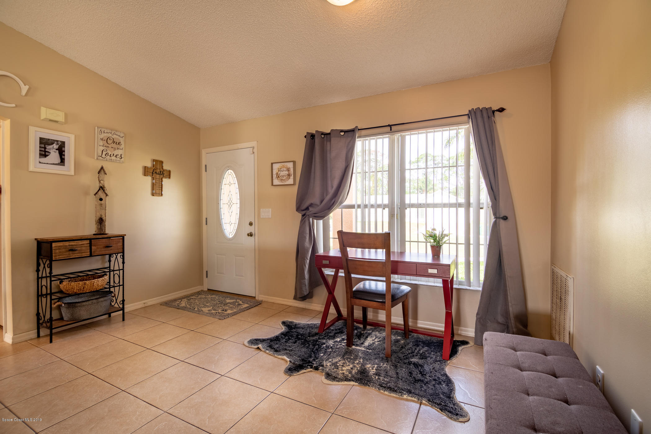 5585 Flint Road Cocoa, FL 32927 - Photo 2 of 14 a workspace with furniture and window