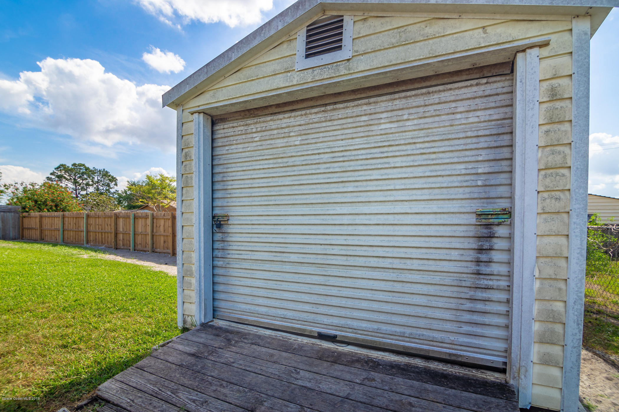 5585 Flint Road Cocoa, FL 32927 - Photo 13 of 14 a view of a backyard with a garden