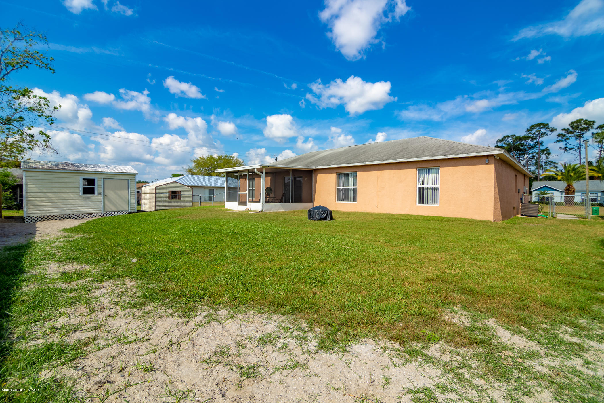 5585 Flint Road Cocoa, FL 32927 - Photo 14 of 14 a view of a house with a yard
