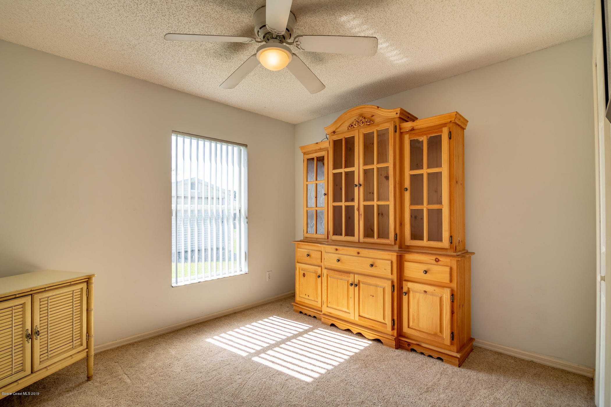 5585 Flint Road Cocoa, FL 32927 - Photo 9 of 14 an empty room with windows