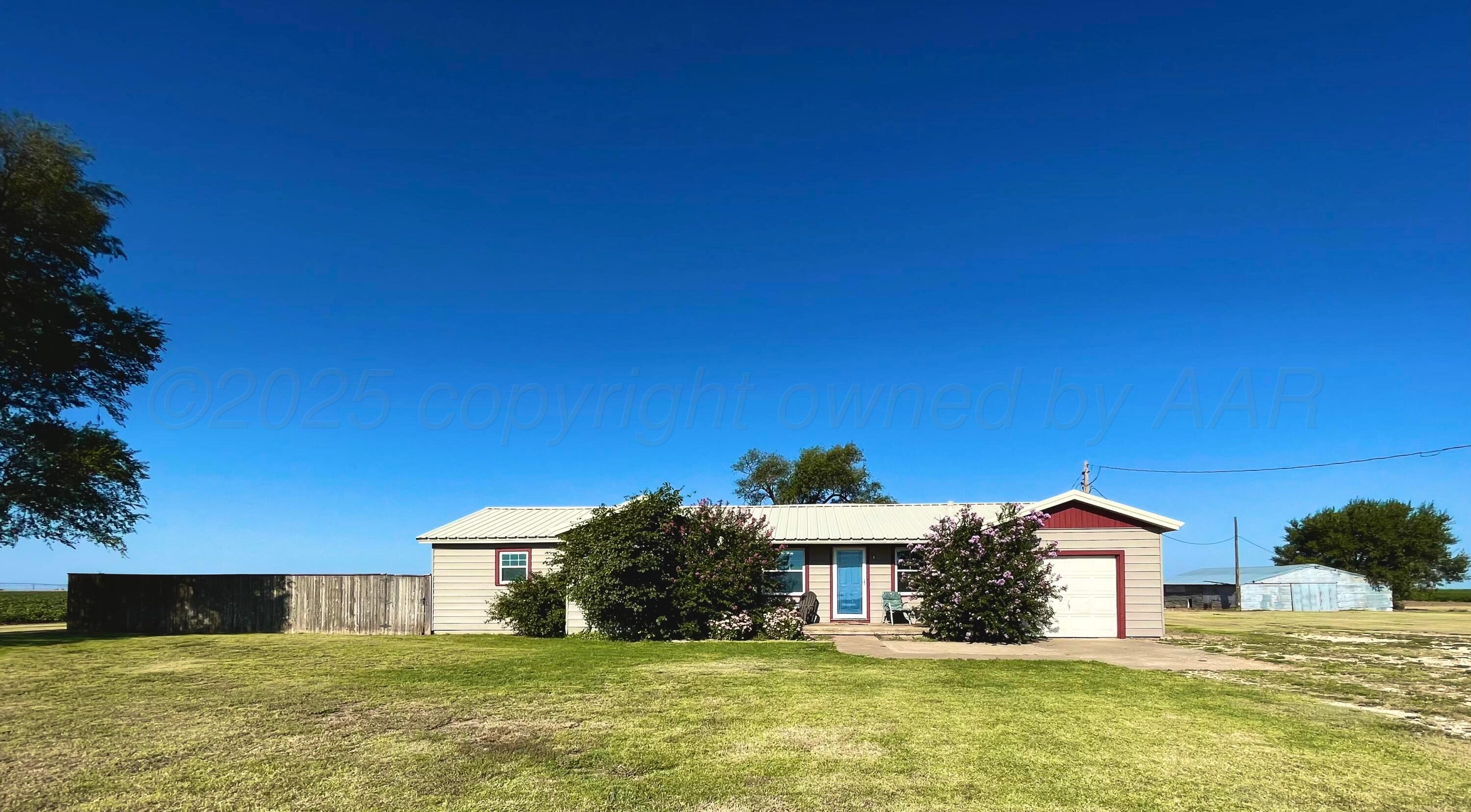 a view of a house with a big yard