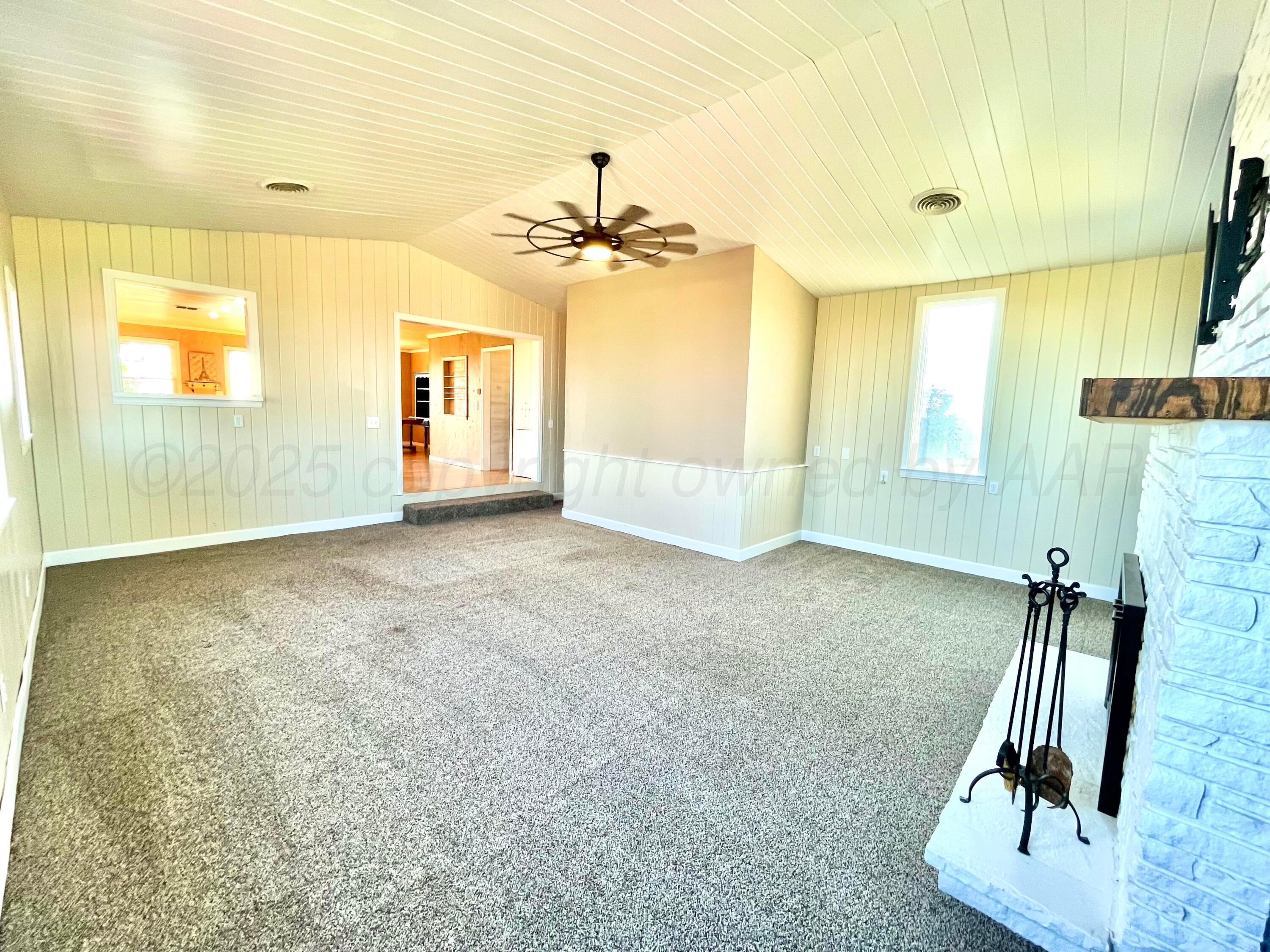 253 Fm 378 Silverton, TX 79257 - Photo 6 of 18 wooden floor in an empty room with a window