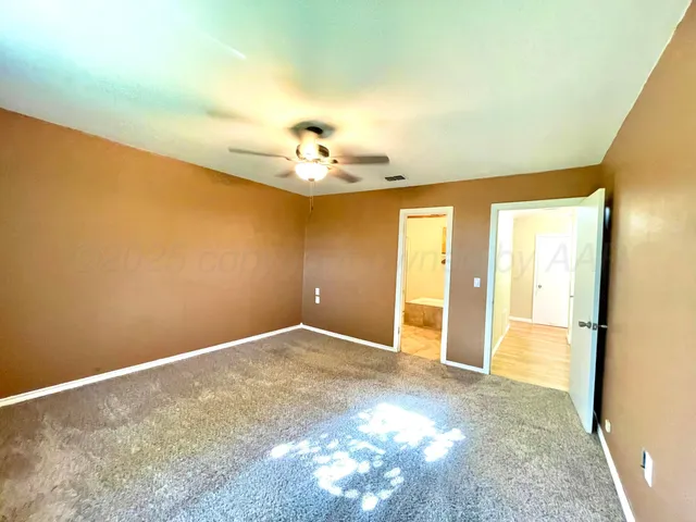a spacious bathroom with a bathtub and a shower