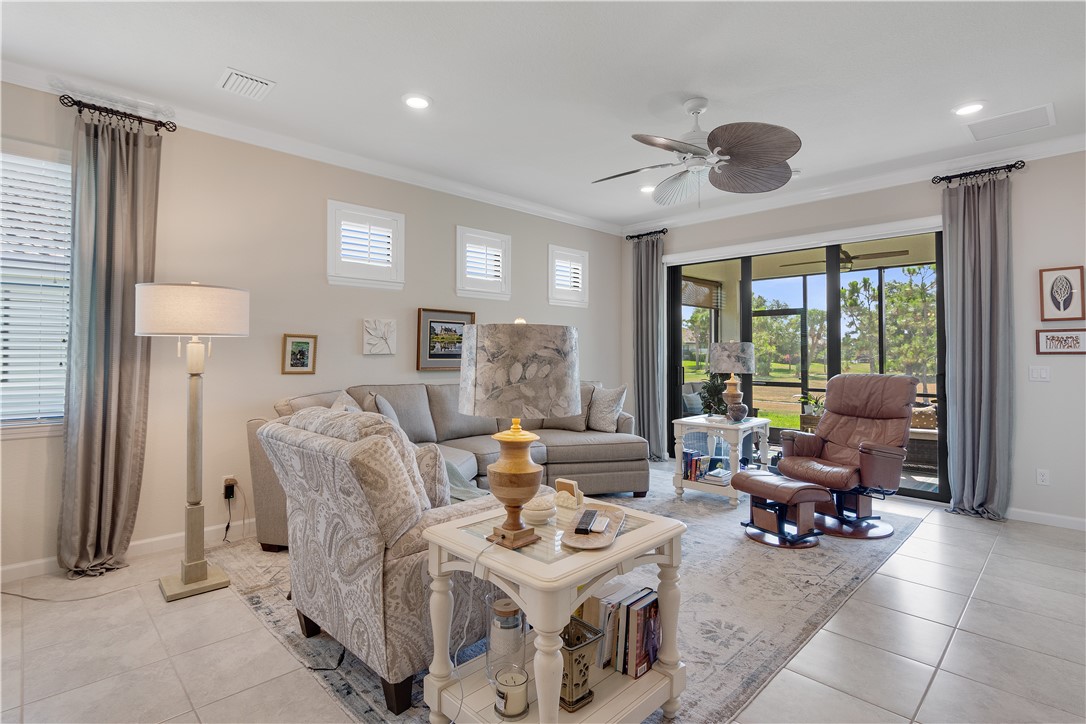 5122 Unity Square Vero Beach, FL 32967 - Photo 12 of 33 a living room with furniture and a large window
