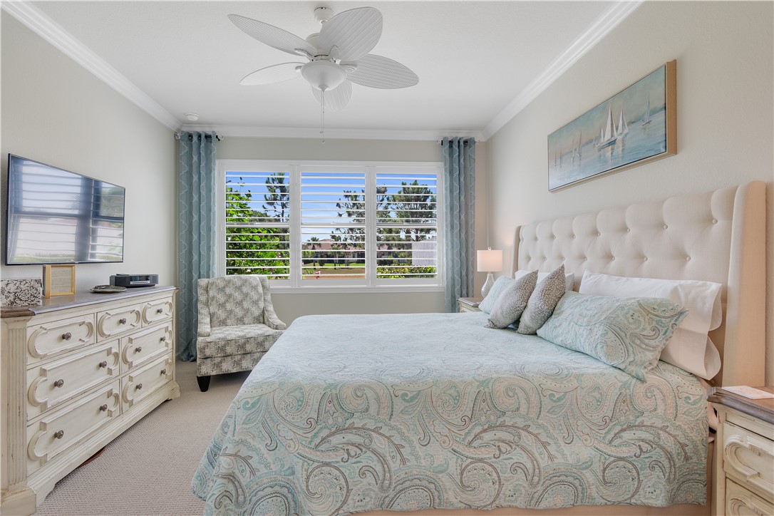 5122 Unity Square Vero Beach, FL 32967 - Photo 14 of 33 a bedroom with a large bed and a window