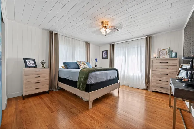 a bedroom with a bed and a closet