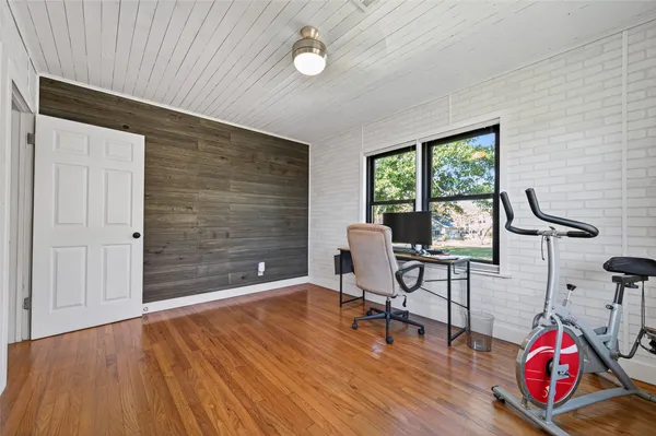 a view of a livingroom with furniture and a window