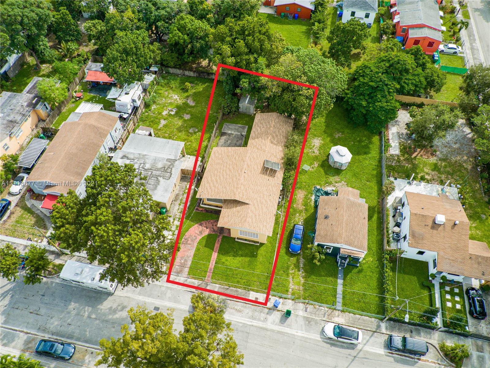 270 Northwest 50th Street Miami, FL 33127 - Photo 2 of 21 an aerial view of a house with a yard and garden