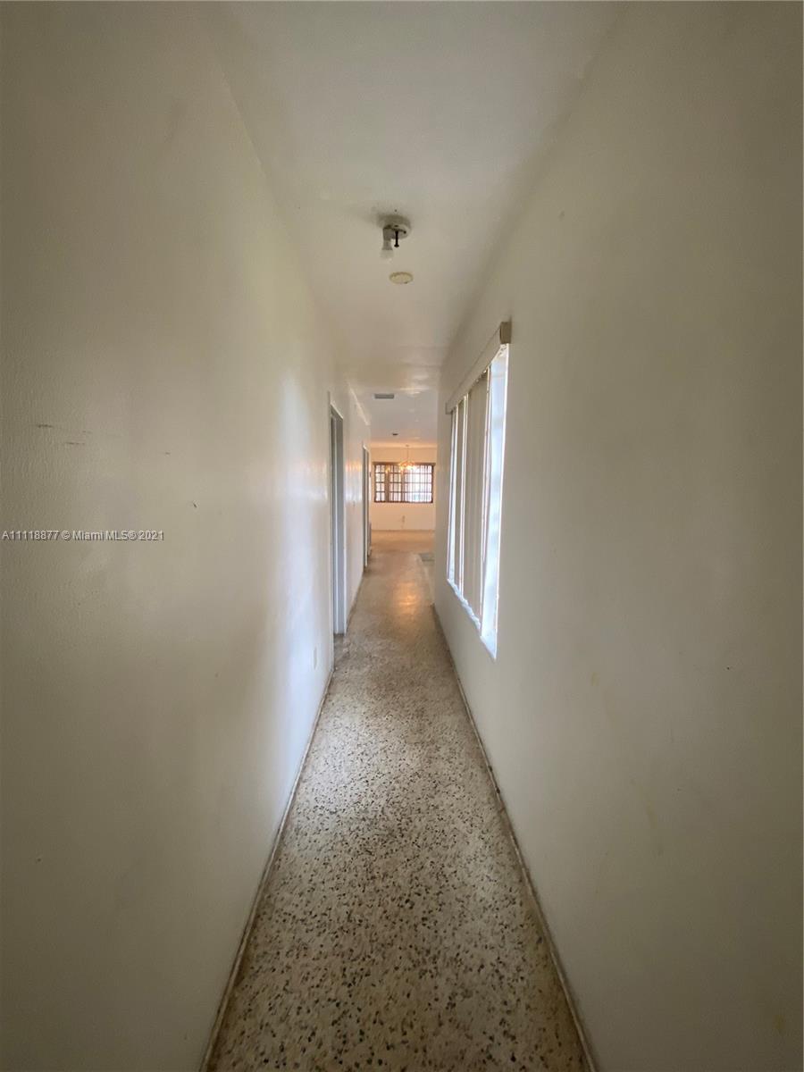 270 Northwest 50th Street Miami, FL 33127 - Photo 13 of 21 a view of a hallway with windows