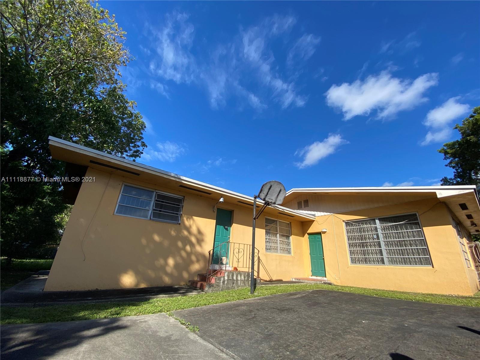 270 Northwest 50th Street Miami, FL 33127 - Photo 18 of 21 a view of a house with a yard
