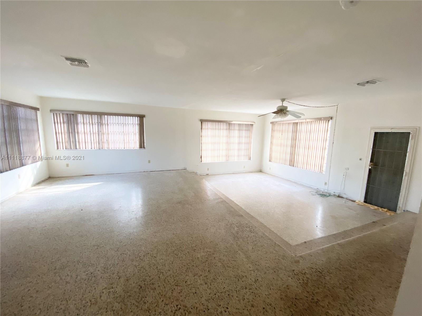 270 Northwest 50th Street Miami, FL 33127 - Photo 8 of 21 a view of a livingroom with a window