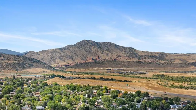 a view of an ocean and a mountain