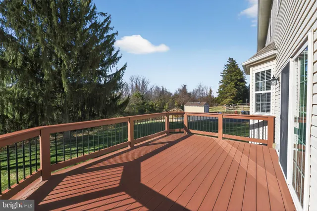 a view of balcony with deck and wooden floor