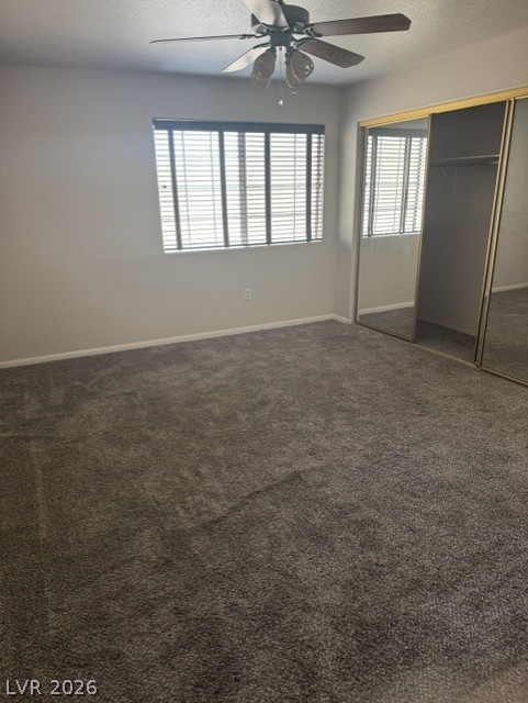 1851 Hillpointe Road, Unit 1412 Henderson, NV 89074 - Photo 4 of 12 Well-lit room features soft carpeting and a mirrored closet, offering ample storage and comfort.