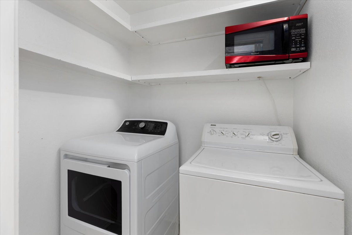 4711 Spicewood Springs Road, Unit 4222 Austin, TX 78759 - Photo 22 of 35 A well-appointed laundry area offers convenient appliance access with spacious shelving.