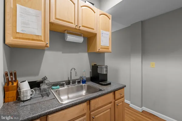 a view of a balcony with wooden floor and iron stairs