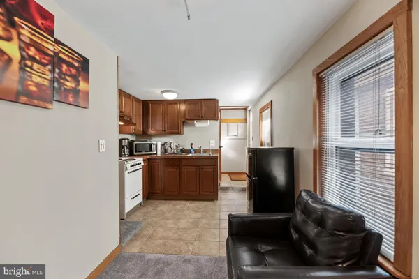 a bedroom with a large bed and a couch