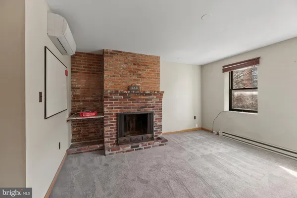 a spacious bedroom with a bed and a desk