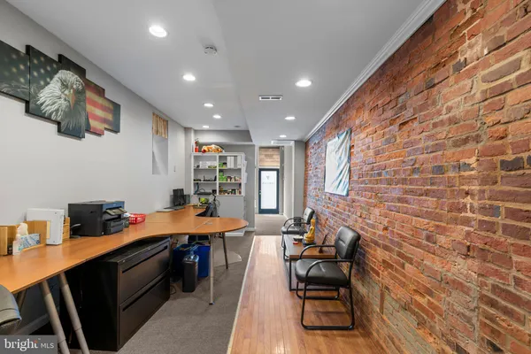 a workspace with furniture and window
