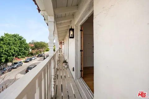 a view of a house with wooden floor and stairs