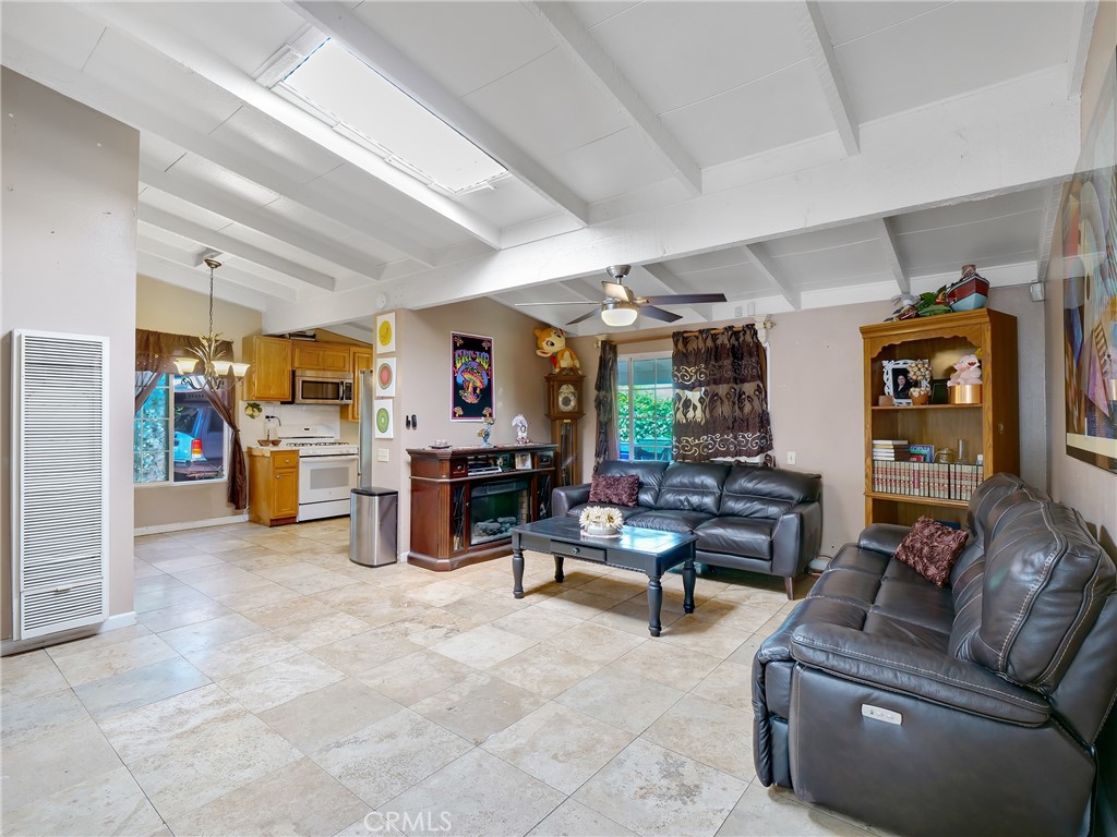 820 Raintree Place Vista, CA 92084 - Photo 11 of 29 a living room with furniture and a kitchen