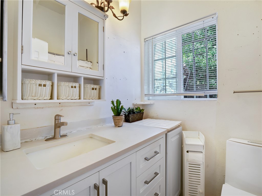 820 Raintree Place Vista, CA 92084 - Photo 13 of 29 a bathroom with a sink and a mirror