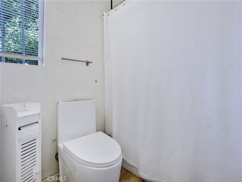 820 Raintree Place Vista, CA 92084 - Photo 15 of 29 a white toilet sitting next to a shower