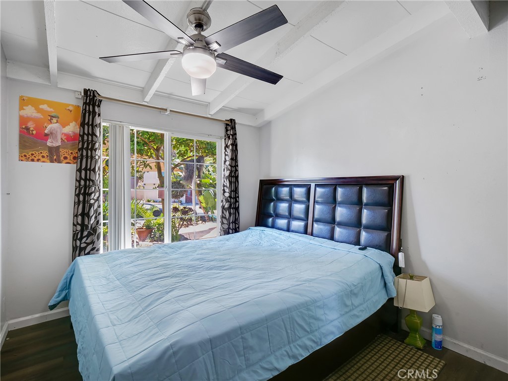 820 Raintree Place Vista, CA 92084 - Photo 18 of 29 a bedroom with a large bed and a window