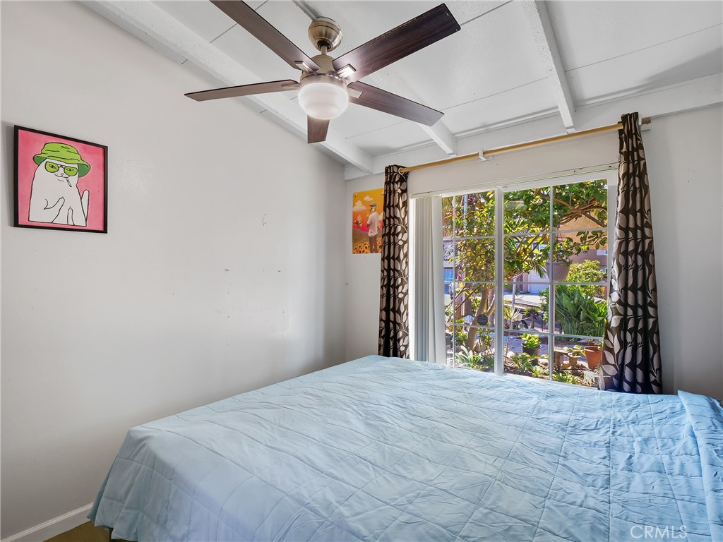 820 Raintree Place Vista, CA 92084 - Photo 19 of 29 a bedroom with a large bed and a large window
