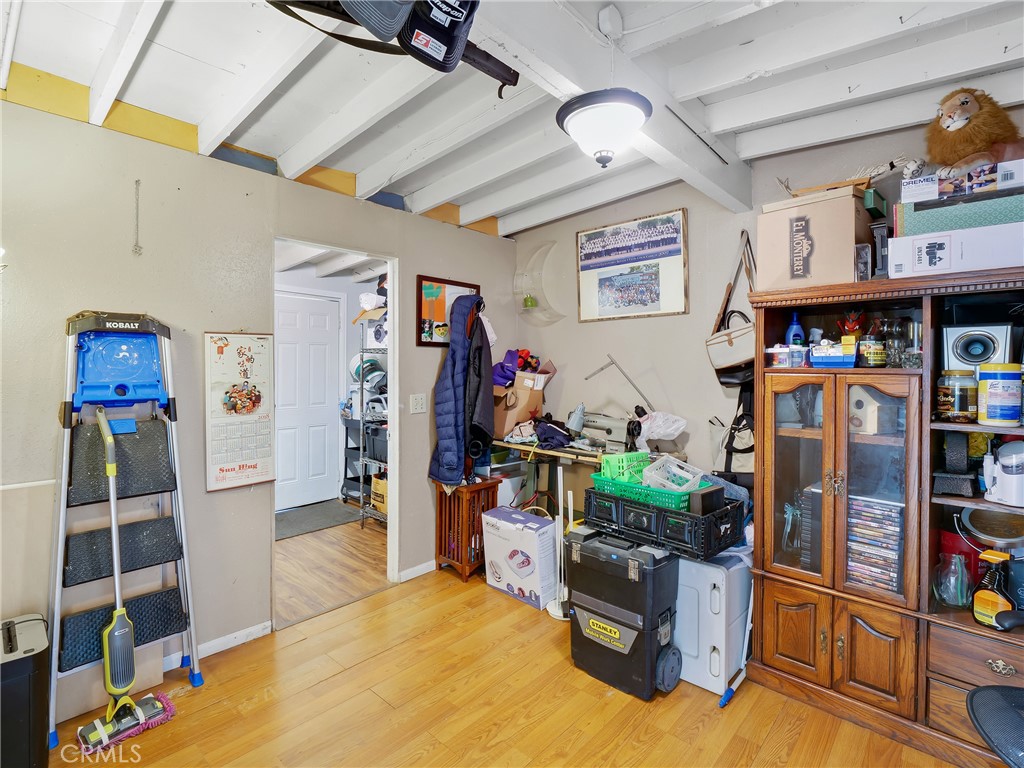 820 Raintree Place Vista, CA 92084 - Photo 22 of 29 a view of a room with lots of stuff and hardwood floor