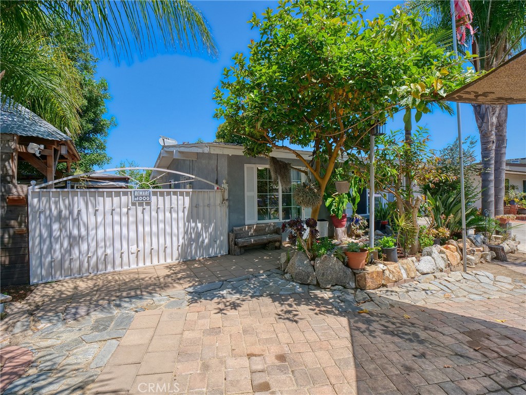 820 Raintree Place Vista, CA 92084 - Photo 25 of 29 a view of a house with a small yard and wooden fence
