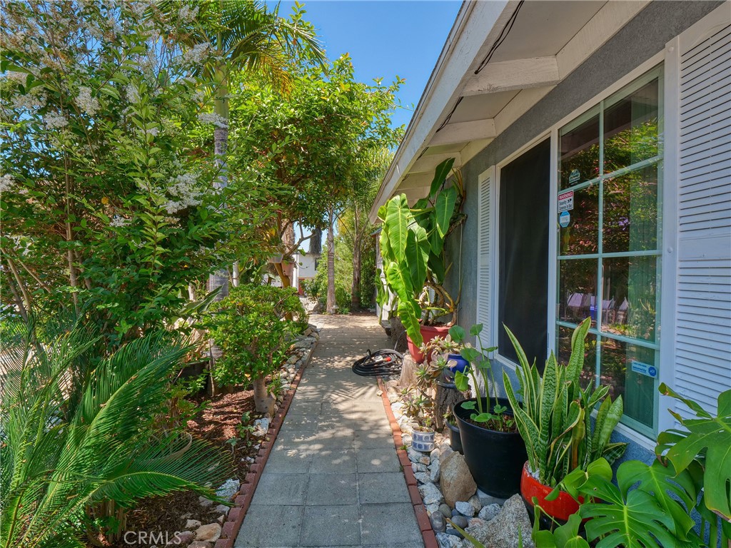 820 Raintree Place Vista, CA 92084 - Photo 3 of 29 a backyard of a house with outdoor seating and green space