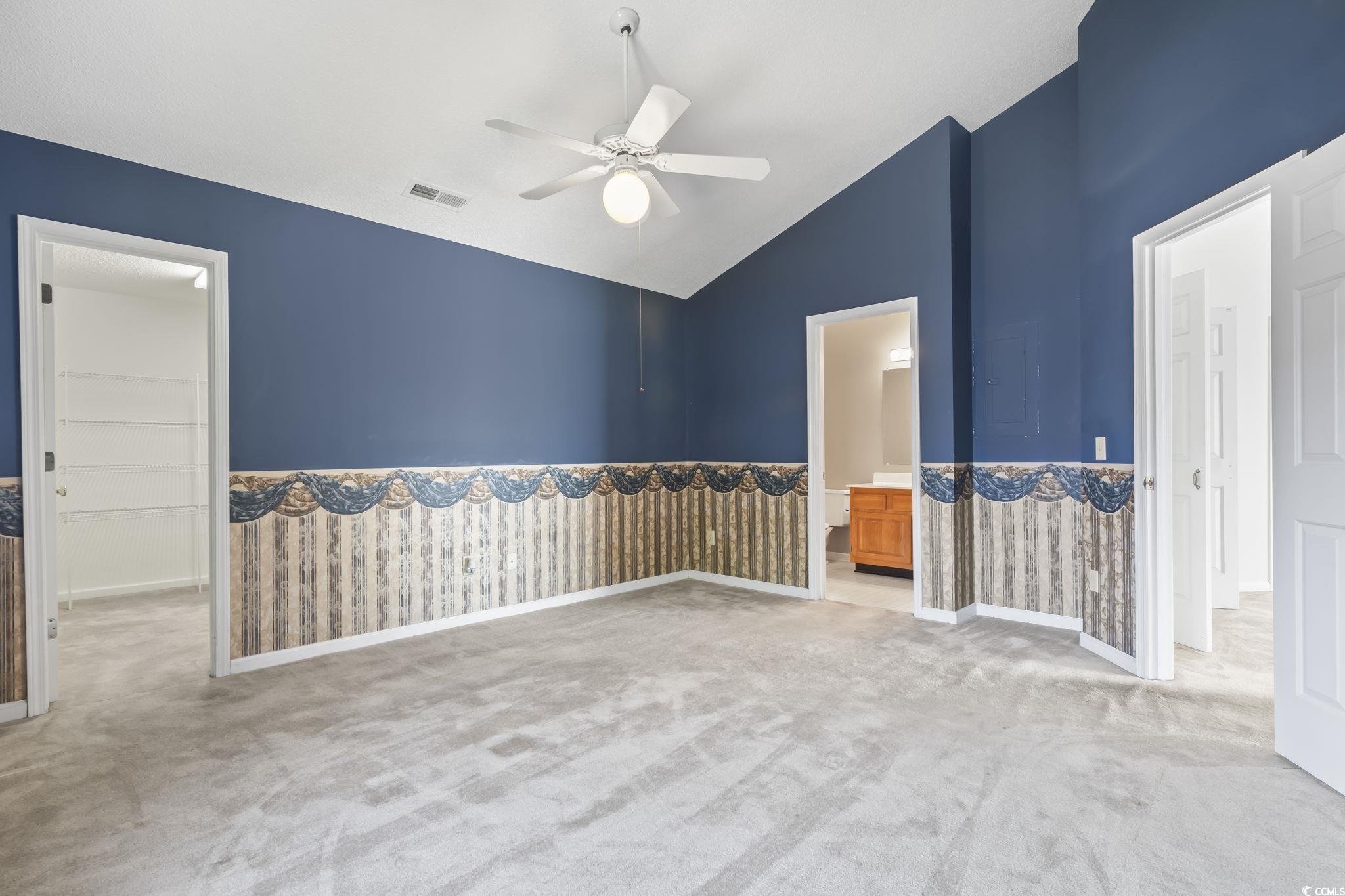 914 Dock Place Murrells Inlet, SC 29576 - Photo 18 of 37 Carpeted spare room with a ceiling fan and high vaulted ceiling