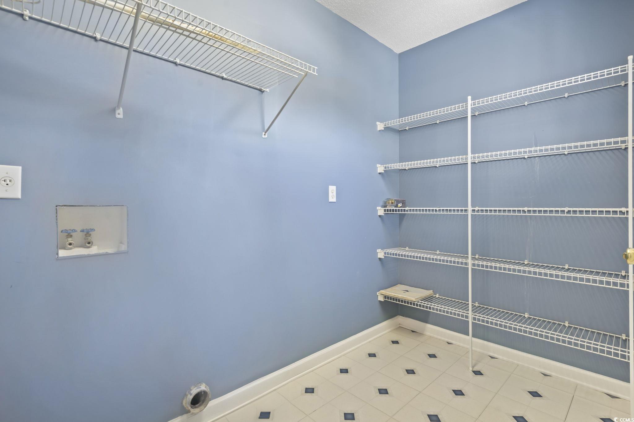 914 Dock Place Murrells Inlet, SC 29576 - Photo 22 of 37 Laundry area featuring tile patterned flooring, hookup for an electric dryer, and hookup for a washing machine