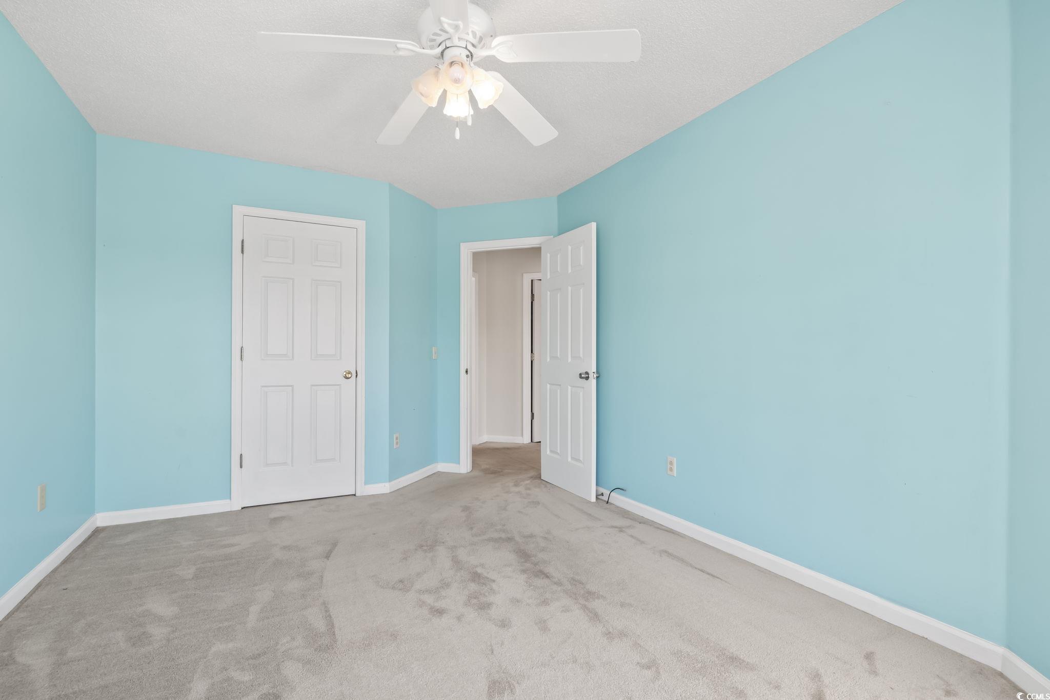 914 Dock Place Murrells Inlet, SC 29576 - Photo 24 of 37 Unfurnished bedroom with carpet, baseboards, and ceiling fan