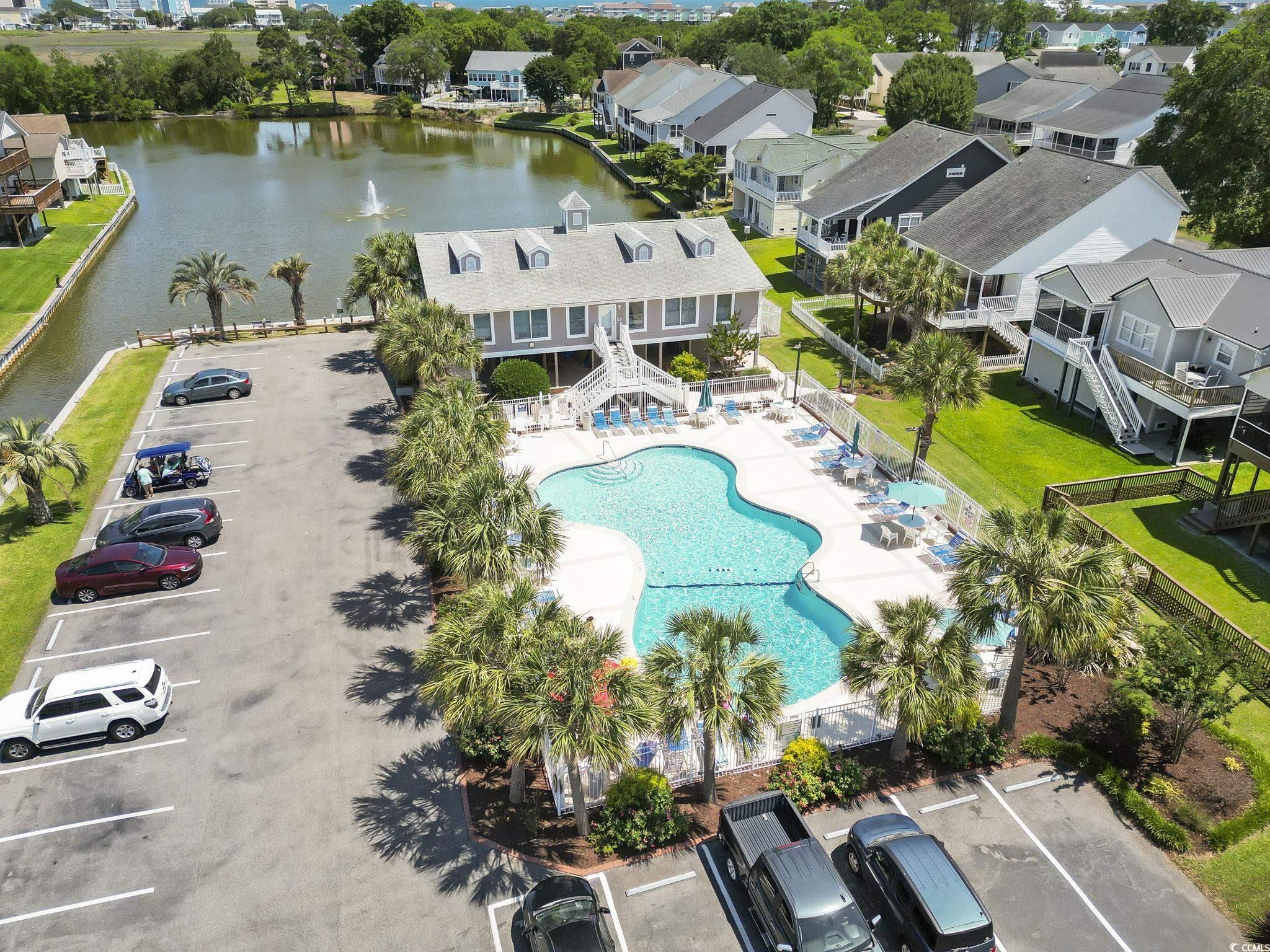 914 Dock Place Murrells Inlet, SC 29576 - Photo 29 of 37 Aerial perspective of suburban area with a pool area and a large body of water
