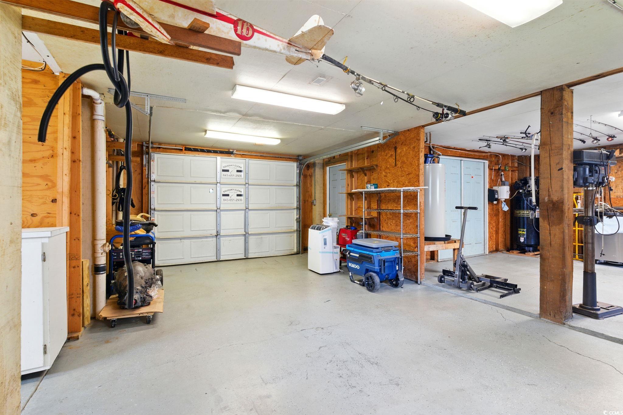 914 Dock Place Murrells Inlet, SC 29576 - Photo 34 of 37 Garage with water heater