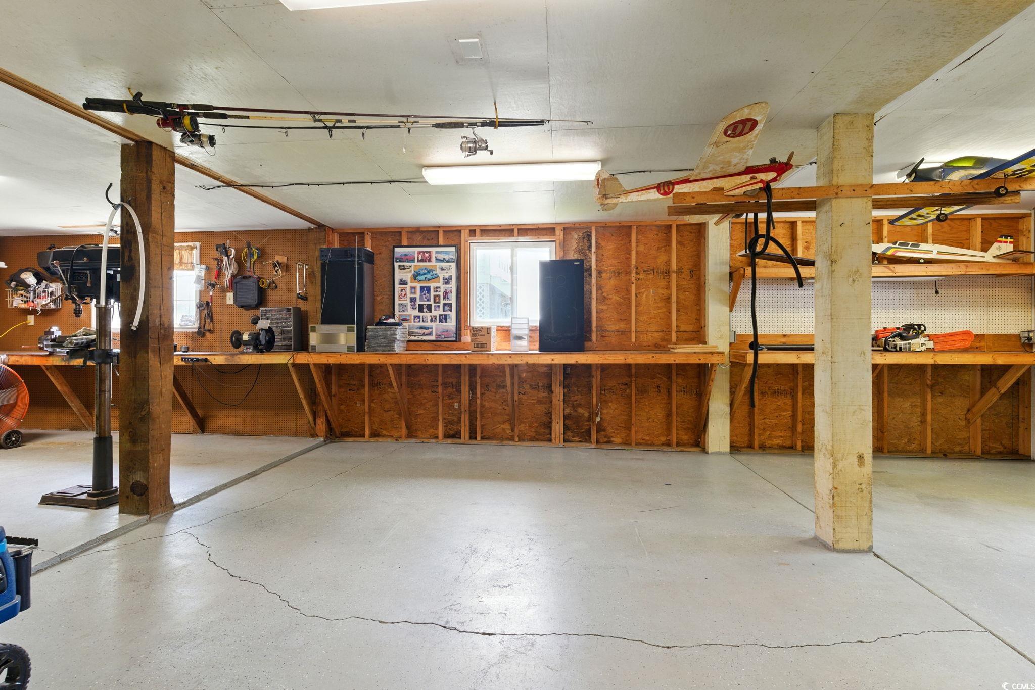 914 Dock Place Murrells Inlet, SC 29576 - Photo 35 of 37 Garage with a workshop area
