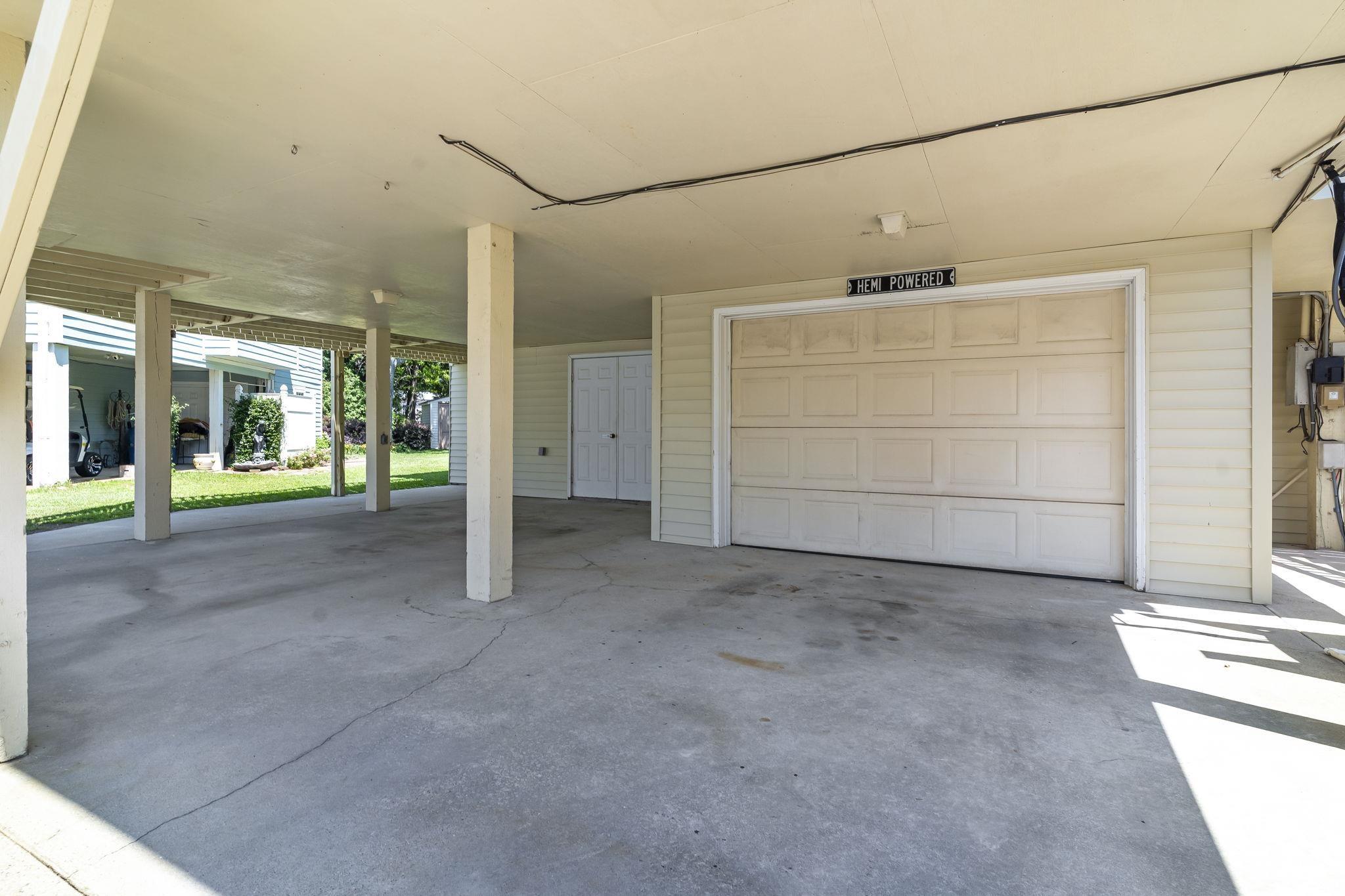 914 Dock Place Murrells Inlet, SC 29576 - Photo 7 of 37 Garage with a carport