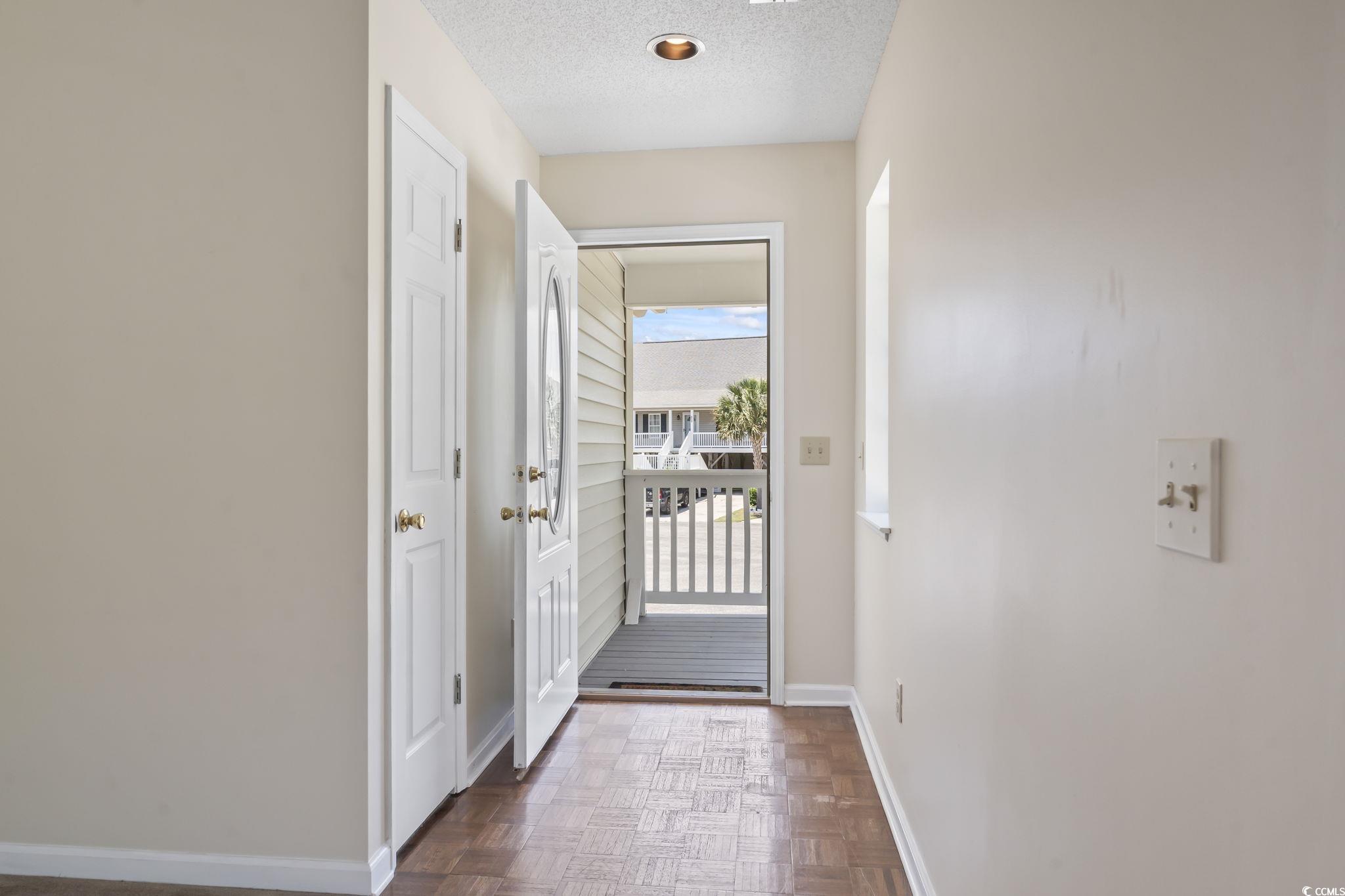 914 Dock Place Murrells Inlet, SC 29576 - Photo 10 of 37 Entryway featuring baseboards and a textured ceiling