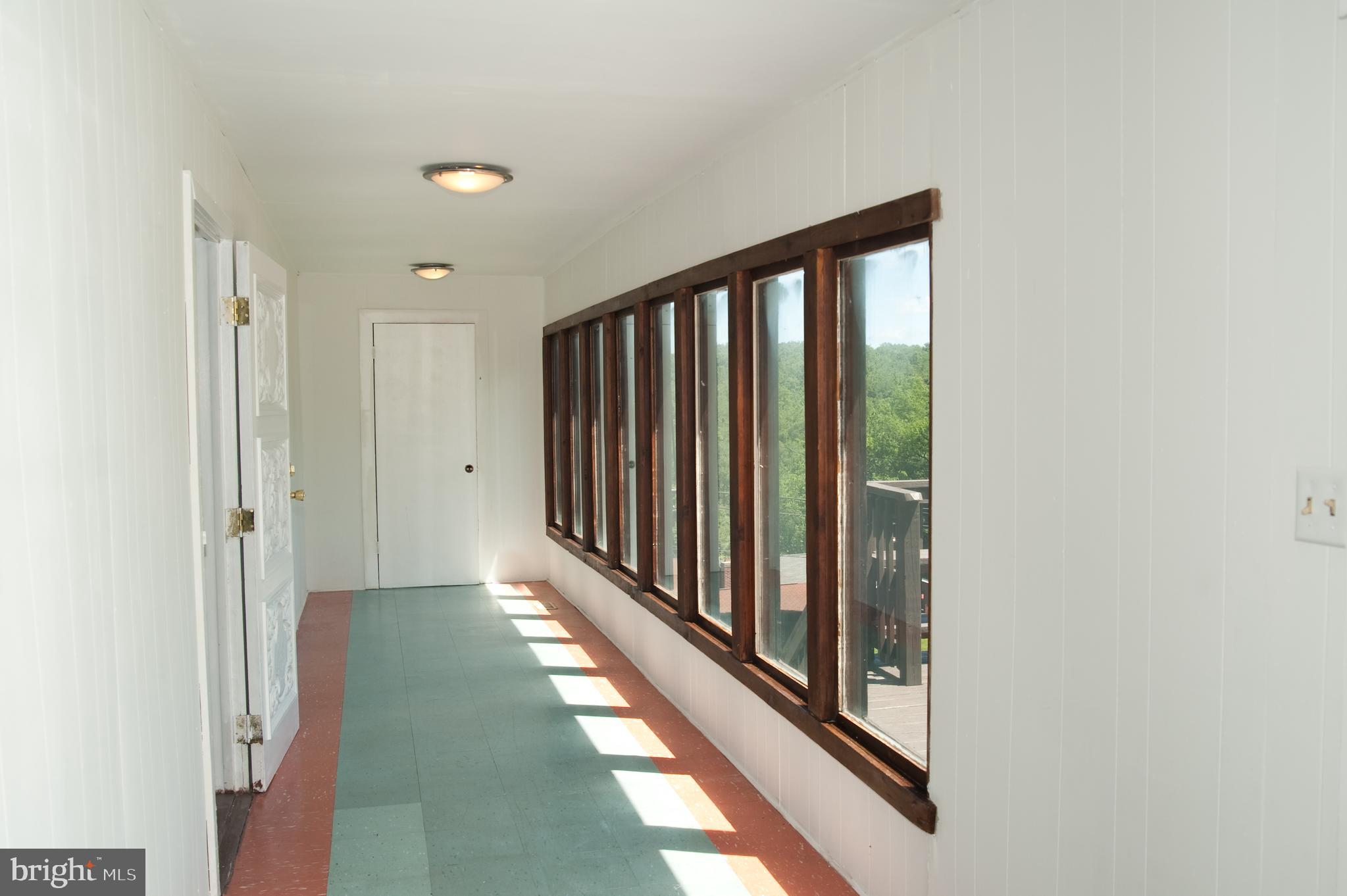 17511 Top Row Road Southwest Frostburg, MD 21532 - Photo 4 of 27 Bright and sunny sun room, welcoming entrance!