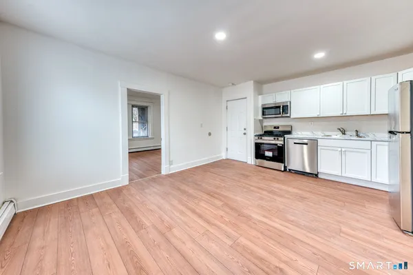 a view of a kitchen with a sink and dishwasher kitchen view