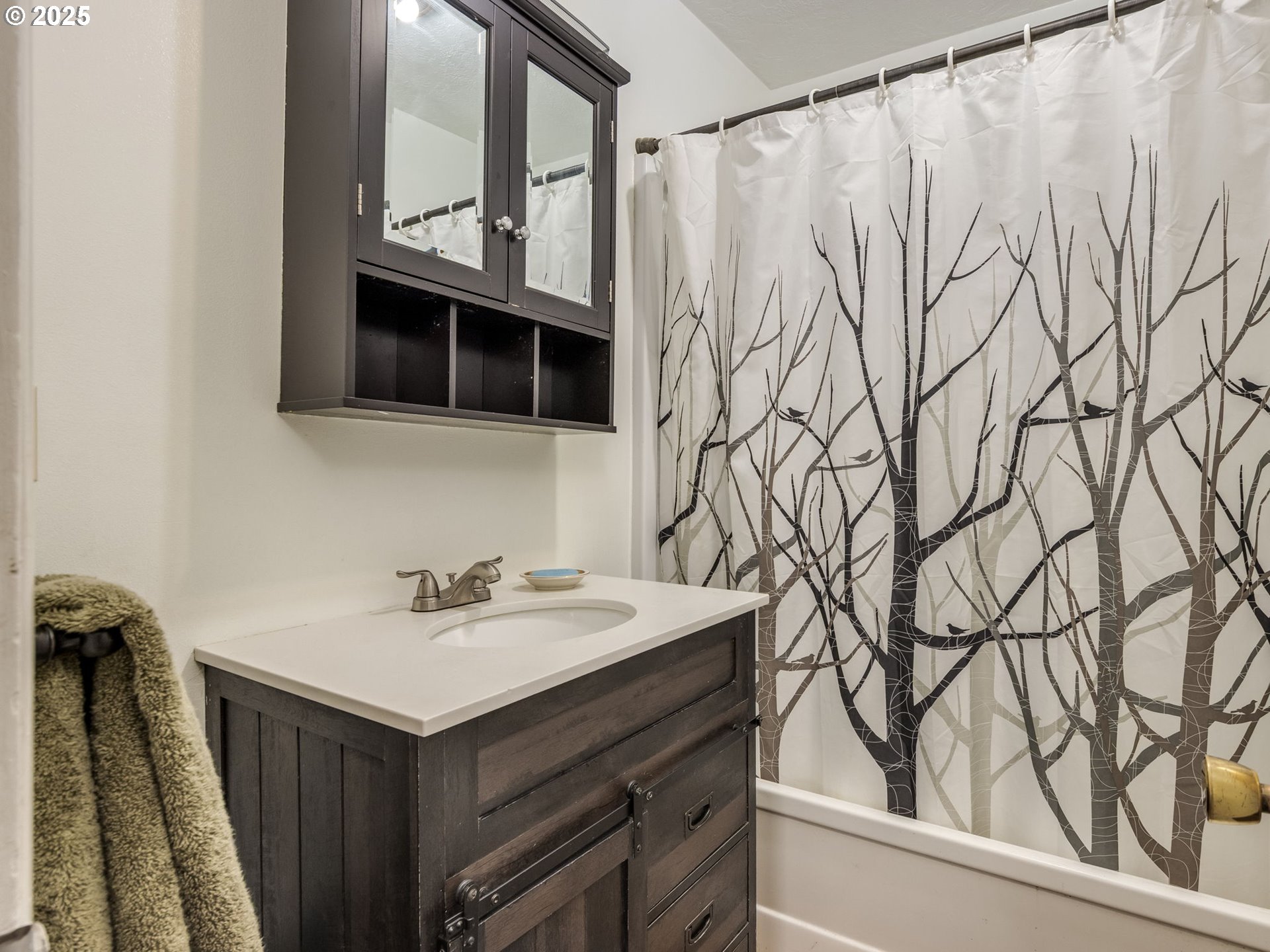 4731 Northeast 106th Avenue Portland, OR 97220 - Photo 17 of 44 a bathroom with a sink and a mirror