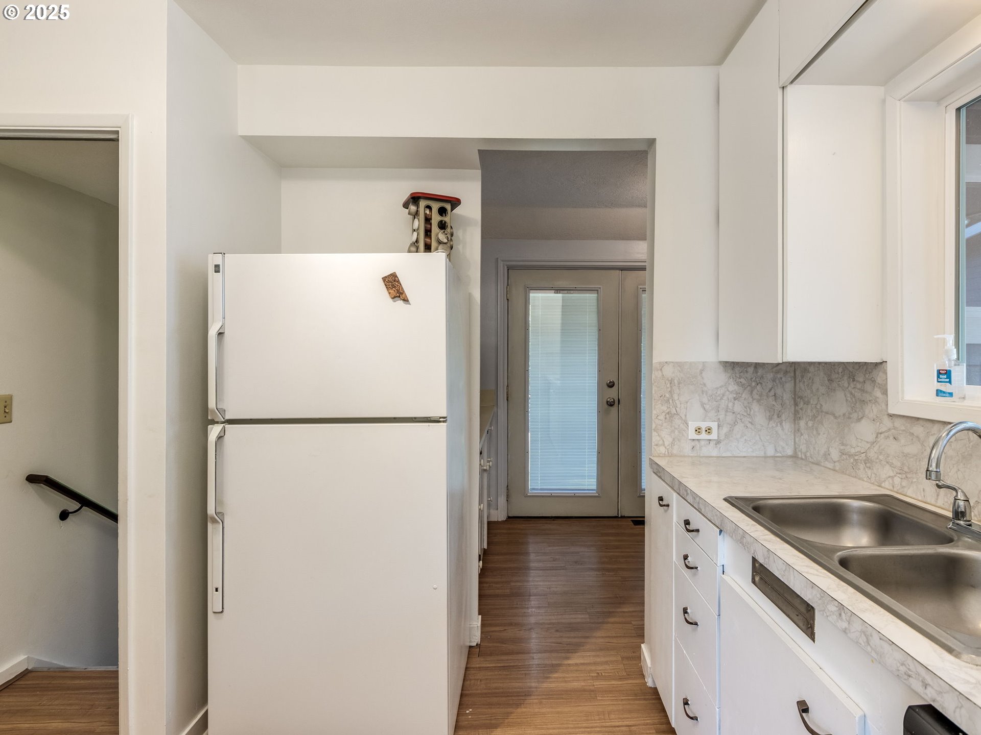 4731 Northeast 106th Avenue Portland, OR 97220 - Photo 21 of 44 a white refrigerator freezer sitting inside of a kitchen