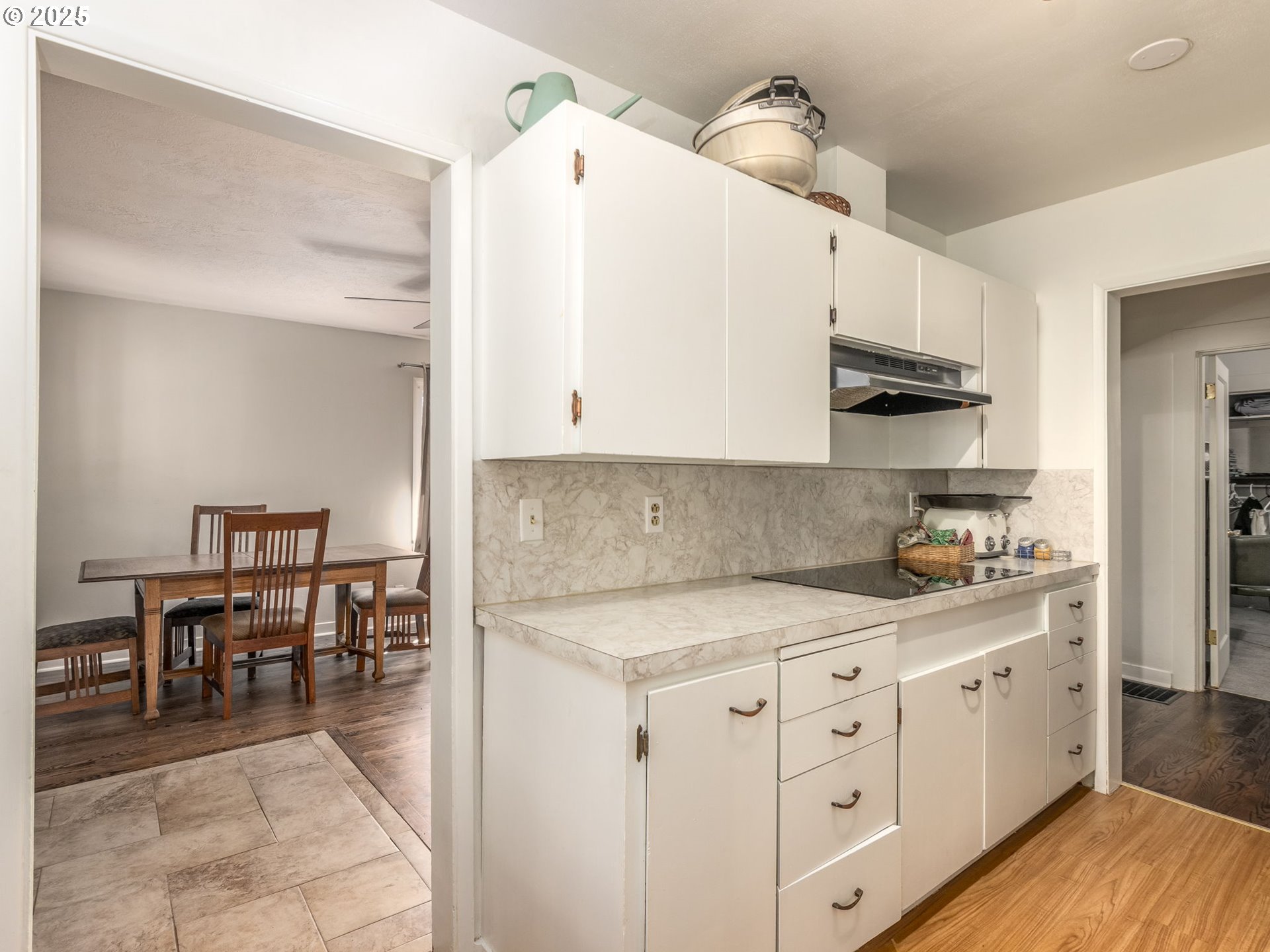 4731 Northeast 106th Avenue Portland, OR 97220 - Photo 22 of 44 a kitchen with white cabinets and appliances