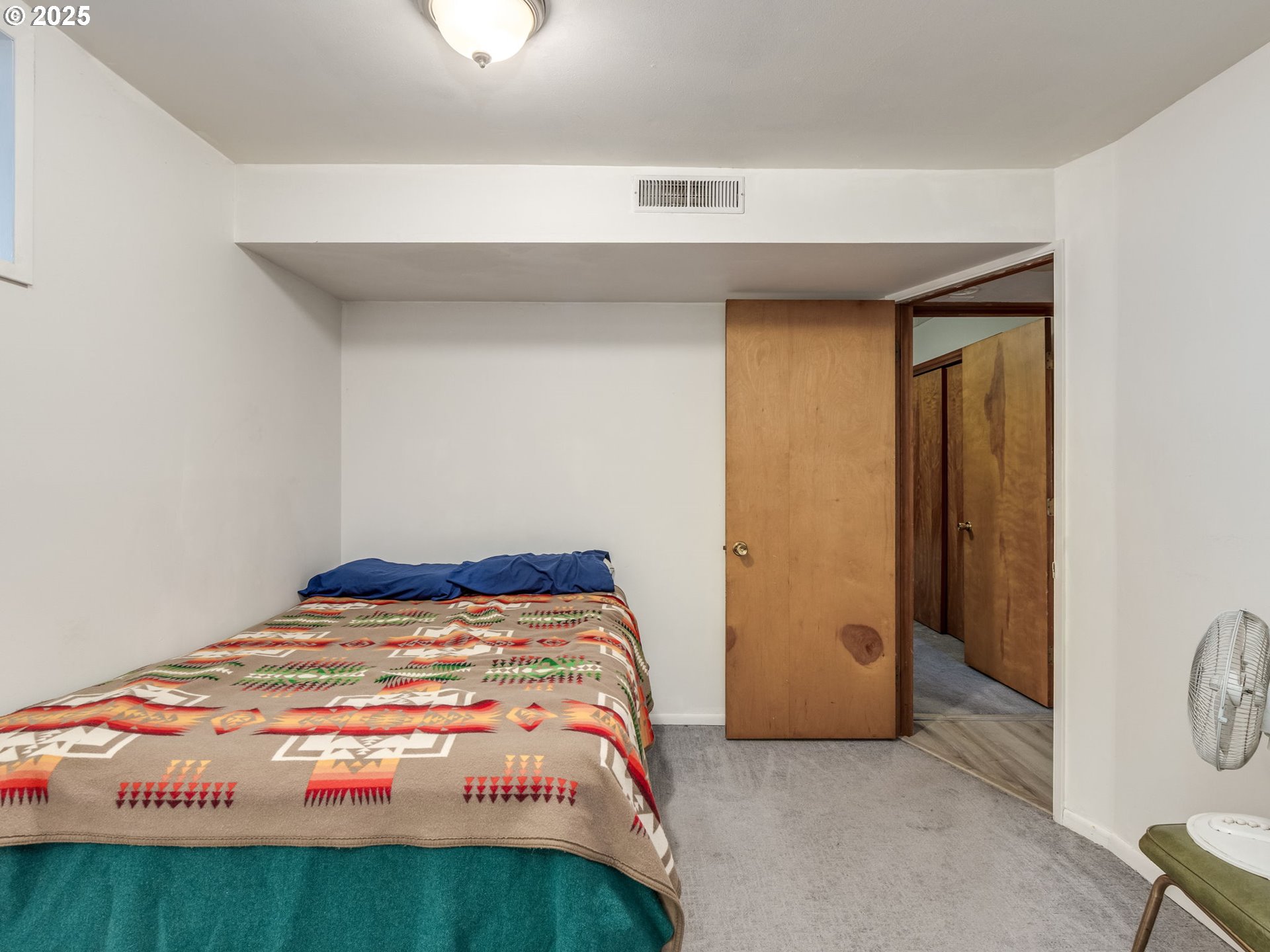 4731 Northeast 106th Avenue Portland, OR 97220 - Photo 26 of 44 a bedroom with a bed and a cabinets