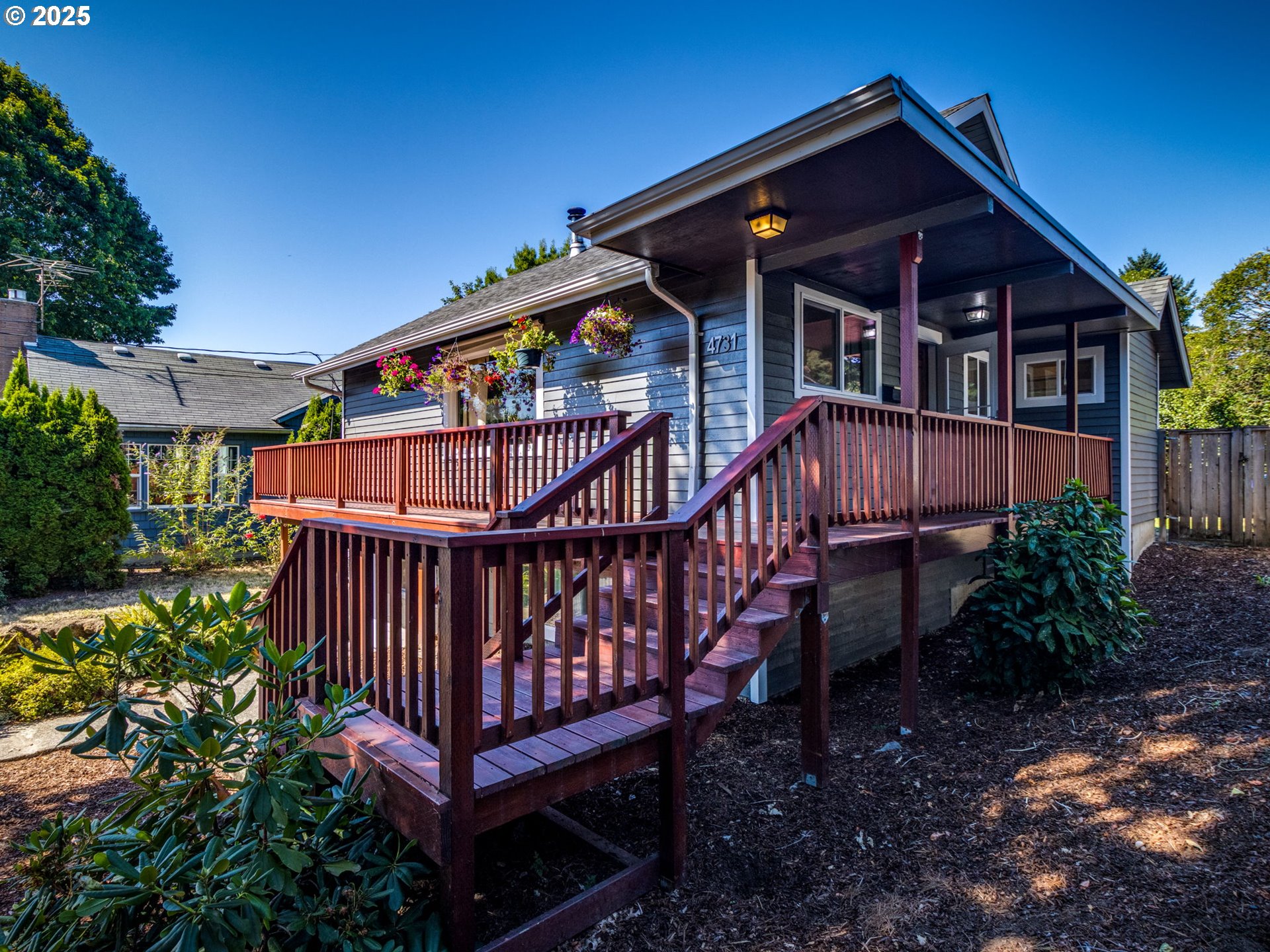 4731 Northeast 106th Avenue Portland, OR 97220 - Photo 3 of 44 a front view of a house with garden and deck